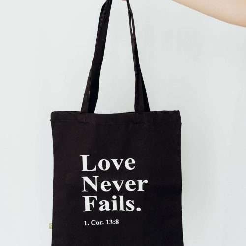 christliches Produkt Tasche ' Love never fails.'